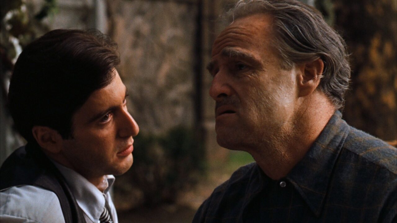Primi piani di Al Pacino e Marlon Brando ne Il padrino