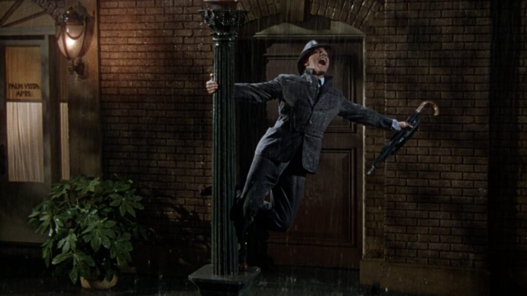 Figura intera di Gene Kelly in Cantando sotto la pioggia